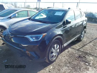 2018 Toyota RAV4 LE with VIN 2T3BFREV8JW706999, listed as a IAAI auction lot 41863485 with 115,589 mi miles. Bid and sale history available at carsss.com. Image 17.