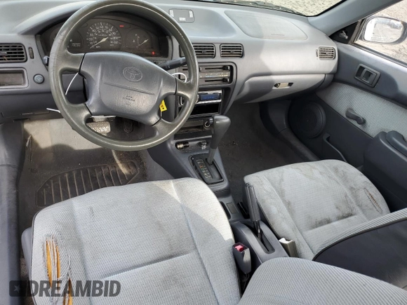 1996 Toyota Tercel DX z VIN JT2AC52L2T0137695, wystawiony jako Copart lot #86535844 z przebiegiem 246 554 mil mil oraz Czysty tytuł • Clean title. Historia ofert i sprzedaży dostępna na DreamBid. Obrazek 8.