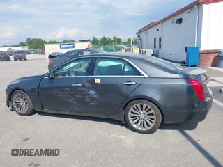 2014 Cadillac CTS Luxury AWD z VIN 1G6AX5SX7E0173466, wystawiony jako IAAI lot #42187266 z przebiegiem 115 140 mil mil oraz . Historia ofert i sprzedaży dostępna na DreamBid. Obrazek 13.