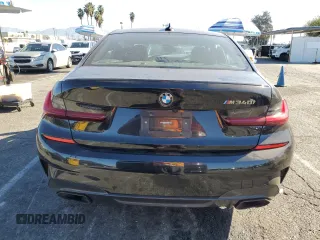 2022 BMW 3 Series M340i with VIN 3MW5U7J04N8C55794, listed as a Copart auction lot 80082294 with 0 mi miles and Salvage Title. Bid and sale history available at carsss.com. Image 6.