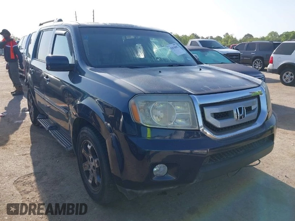 2011 Honda Pilot Touring with VIN 5FNYF4H92BB090056, listed as a IAAI auction lot 42010682 with 201,640 mi miles. Bid and sale history available at carsss.com. Image 1.