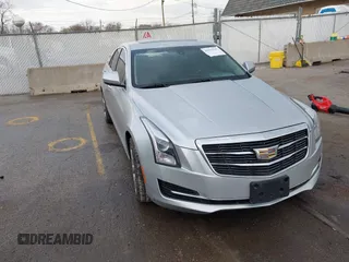 2016 Cadillac ATS Standard AWD z VIN 1G6AG5RX0G0163077, wystawiony jako IAAI lot #41914167 z przebiegiem 104 280 mil mil oraz . Historia ofert i sprzedaży dostępna na DreamBid. Obrazek 1.