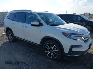 2022 Honda Pilot Touring 7-Passenger with VIN 5FNYF6H67NB017660, listed as a IAAI auction lot 41194603 with 87,301 mi miles. Bid and sale history available at carsss.com. Image 1.