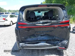 2023 Chrysler Pacifica Touring L with VIN 2C4RC1BG2PR534194, listed as a IAAI auction lot 42613934 with 69,896 mi miles and . Bid and sale history available at DreamBid. Image 6.