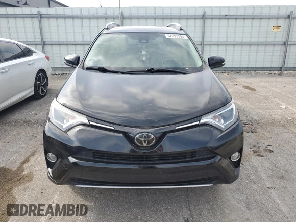 2018 Toyota RAV4 XLE with VIN 2T3WFREV3JW469307, listed as a Copart auction lot 57092295 with 47,639 mi miles and Salvage title. Bid and sale history available at DreamBid. Image 5.