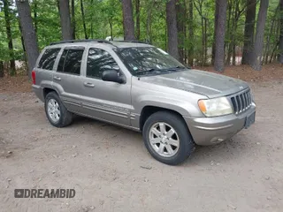 1999 Jeep Grand Cherokee Limited with VIN 1J4GW68N5XC684157, listed as a IAAI auction lot 42104283 with 164,506 mi miles. Bid and sale history available at carsss.com. Image 1.