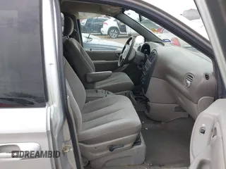 2003 Dodge Caravan Sport with VIN 2D4GP44L13R199188, listed as a IAAI auction lot 42154107 with Not Provided miles and . Bid and sale history available at carsss.com. Image 5.