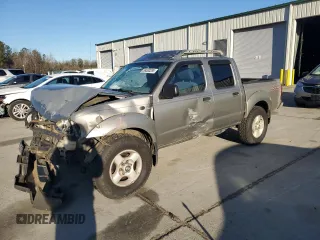 2002 Nissan Frontier SVE with VIN 1N6MD27Y22C389865, listed as a Copart auction lot 89300285 with 196,212 mi miles and Salvage title. Bid and sale history available at DreamBid. Image 1.