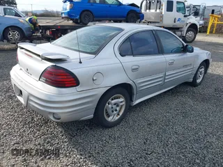2001 Pontiac Grand Am SE1 with VIN 1G2NF52TX1M560650, listed as a IAAI auction lot 41654339 with 122,885 mi miles. Bid and sale history available at carsss.com. Image 4.
