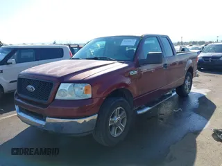 2005 Ford F-150 XLT with VIN 1FTPX12565NA45477, listed as a IAAI auction lot 41448417 with 145,039 mi miles. Bid and sale history available at carsss.com. Image 2.