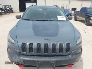 2015 Jeep Cherokee Trailhawk with VIN 1C4PJMBS0FW524479, listed as a IAAI auction lot 41908871 with 118,825 mi miles and . Bid and sale history available at DreamBid. Image 12.
