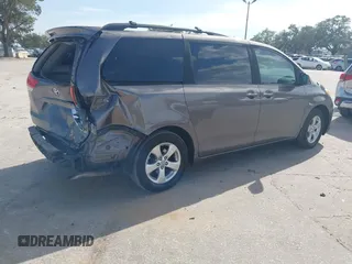 2014 Toyota Sienna LE AAS with VIN 5TDKK3DCXES432611, listed as a IAAI auction lot 40771635 with 214,145 mi miles and . Bid and sale history available at carsss.com. Image 4.