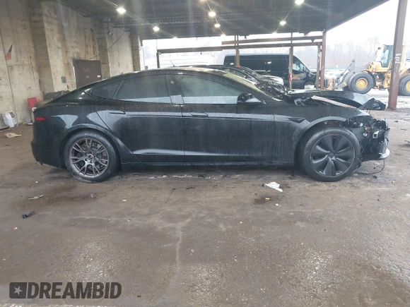 2022 Tesla Model S Plaid with VIN 5YJSA1E64NF477855, listed as a IAAI auction lot 41470591 with Not provided miles and . Bid and sale history available at DreamBid. Image 13.