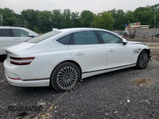 2023 Genesis G80 z VIN KMTGE4S18PU006369, wystawiony jako Copart lot #57445225 z przebiegiem 25 083 mil mil oraz Szkody całkowita. Historia ofert i sprzedaży dostępna na DreamBid. Obrazek 3.