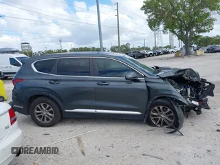 2019 Hyundai Santa Fe SE with VIN 5NMS23AD9KH037136, listed as a IAAI auction lot 41744001 with 150,745 mi miles. Bid and sale history available at carsss.com. Image 14.
