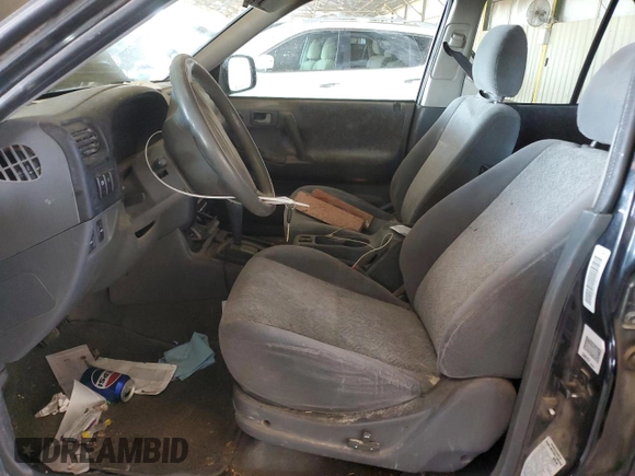 2001 Isuzu Rodeo S with VIN 4S2CK58W614344850, listed as a Copart auction lot 63807664 with 176,203 mi miles and Salvage title. Bid and sale history available at DreamBid. Image 7.