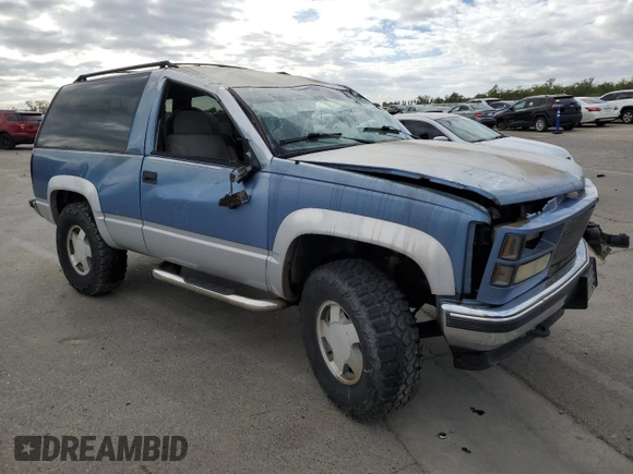 1995 GMC Yukon with VIN 1GKEK18K6SJ710419, listed as a Copart auction lot 80778474 with 215,789 mi miles and Salvage Title. Bid and sale history available at carsss.com. Image 4.