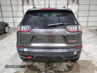 2020 Jeep Cherokee Trailhawk z VIN 1C4PJMBX5LD591873, wystawiony jako Copart lot #54308695 z przebiegiem 34 615 mil mil oraz Szkoda całkowita • Salvage title. Historia ofert i sprzedaży dostępna na DreamBid. Obrazek 6.