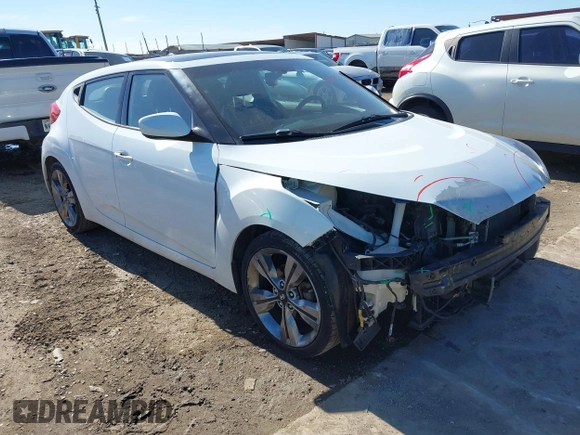 2016 Hyundai Veloster z VIN KMHTC6AD3GU267365, wystawiony jako IAAI lot #41469796 z przebiegiem 111 791 mil mil oraz . Historia ofert i sprzedaży dostępna na DreamBid. Obrazek 1.
