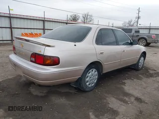 1996 Toyota Camry DX with VIN 4T1BG12K8TU738565, listed as a IAAI auction lot 41702096 with 100,587 mi miles. Bid and sale history available at carsss.com. Image 4.