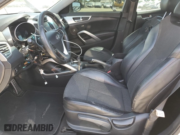 2013 Hyundai Veloster w/Gray Int z VIN KMHTC6AD9DU138719, wystawiony jako Copart lot #57494735 z przebiegiem 149 255 mil mil oraz Szkoda całkowita • Salvage title. Historia ofert i sprzedaży dostępna na DreamBid. Obrazek 7.