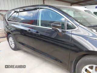 2023 Chrysler Pacifica Touring L with VIN 2C4RC1BG1PR550628, listed as a IAAI auction lot 42553430 with 61,773 mi miles and . Bid and sale history available at DreamBid. Image 14.