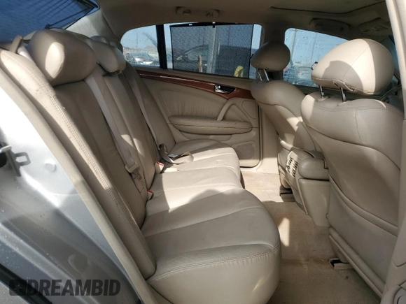 2003 Infiniti Q45 z VIN JNKBF01A03M101890, wystawiony jako Copart lot #86930994 z przebiegiem 158 134 mil mil oraz Szkody całkowita. Historia ofert i sprzedaży dostępna na DreamBid. Obrazek 11.