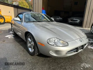 1999 Jaguar XK with VIN SAJGX2048XC041933, listed as a Copart auction lot 46886755 with 67,133 mi miles and Clean Title. Bid and sale history available at DreamBid. Image 1.