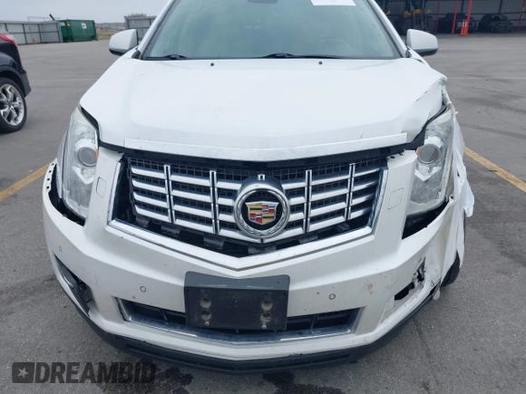 2013 Cadillac SRX Performance Collection z VIN 3GYFNHE35DS569528, wystawiony jako IAAI lot #42329652 z przebiegiem 97 184 mil mil oraz . Historia ofert i sprzedaży dostępna na DreamBid. Obrazek 6.