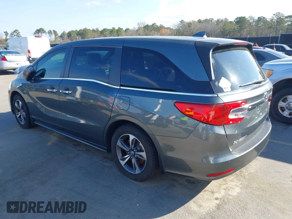 2020 Honda Odyssey Touring z VIN 5FNRL6H8XLB035047, wystawiony jako IAAI lot #41794343 z przebiegiem 57 537 mil mil oraz . Historia ofert i sprzedaży dostępna na DreamBid. Obrazek 3.