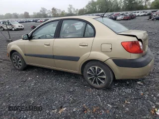 2009 Kia Rio LX with VIN KNADE223096485561, listed as a Copart auction lot 73412874 with 137,858 mi miles and Salvage Title. Bid and sale history available at DreamBid. Image 2.