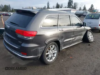 2015 Jeep Grand Cherokee Summit with VIN 1C4RJFJTXFC911170, listed as a IAAI auction lot 41523164 with 74,133 mi miles. Bid and sale history available at carsss.com. Image 4.