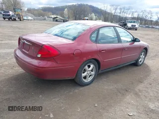 2003 Ford Taurus SE Standard with VIN 1FAFP53UX3G108418, listed as a IAAI auction lot 42042047 with 194,683 mi miles. Bid and sale history available at carsss.com. Image 4.