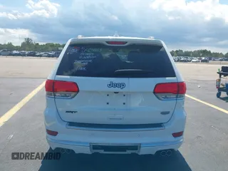 2015 Jeep Grand Cherokee Summit with VIN 1C4RJEJG5FC105038, listed as a IAAI auction lot 42555024 with 133,077 mi miles and . Bid and sale history available at DreamBid. Image 17.