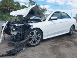 2014 Mercedes-Benz E-Class E 350 Sport with VIN WDDHF5KB1EB019977, listed as a IAAI auction lot 41909260 with 158,095 mi miles. Bid and sale history available at carsss.com. Image 2.