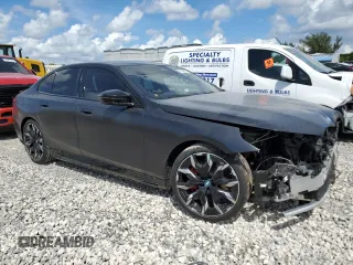 2024 BMW i5 M60 with VIN WBY43FK00RCR71826, listed as a Copart auction lot 72140144 with 5,987 mi miles and Salvage Title. Bid and sale history available at carsss.com. Image 4.