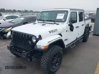 2021 Jeep Gladiator Willys with VIN 1C6HJTAG1ML575474, listed as a IAAI auction lot 41439898 with 44,335 mi miles and . Bid and sale history available at DreamBid. Image 2.