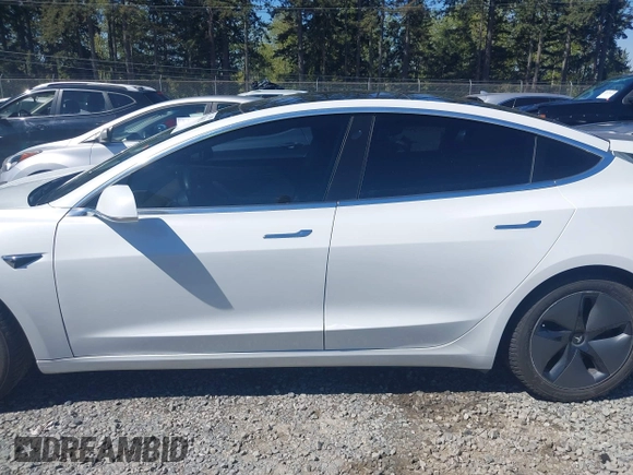 2018 Tesla Model 3 Long Range Battery with VIN 5YJ3E1EA7JF020173, listed as a IAAI auction lot 42046312 with 83,395 mi miles and . Bid and sale history available at DreamBid. Image 15.