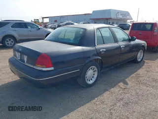 2000 Ford Crown Victoria LX z VIN 2FAFP74W4YX188831, wystawiony jako IAAI lot #41221337 z przebiegiem 169 380 mil mil oraz . Historia ofert i sprzedaży dostępna na DreamBid. Obrazek 4.