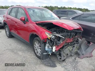 2016 Mazda CX-5 Sport with VIN JM3KE2BY9G0911535, listed as a IAAI auction lot 41906402 with 134,477 mi miles. Bid and sale history available at carsss.com. Image 1.