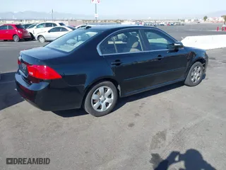 2009 Kia Optima LX with VIN KNAGE228895356658, listed as a IAAI auction lot 41580009 with 216,534 mi miles. Bid and sale history available at carsss.com. Image 4.