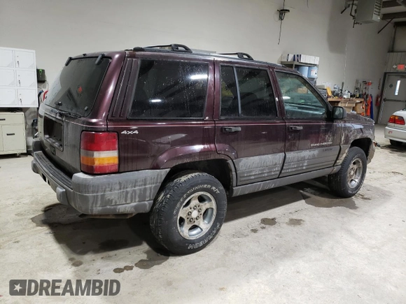 1997 Jeep Grand Cherokee Laredo with VIN 1J4GZ58S6VC573007, listed as a Copart auction lot 42728355 with 164,269 mi miles and Salvage Title. Bid and sale history available at carsss.com. Image 3.