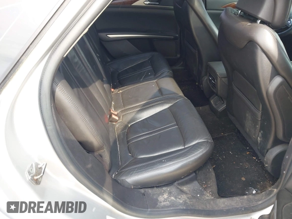 2013 Lincoln MKZ z VIN 3LN6L2G95DR828063, wystawiony jako IAAI lot #42398124 z przebiegiem 158 626 mil mil oraz . Historia ofert i sprzedaży dostępna na DreamBid. Obrazek 8.