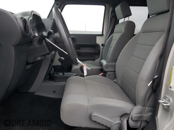 2007 Jeep Wrangler Unlimited Rubicon с VIN 1J8GA691X7L191115, выставлен на аукционе Copart как лот 87523925 с пробегом 85 709 миль миль и Списание • Salvage title. История ставок и продаж доступна на DreamBid. Изображение 7.