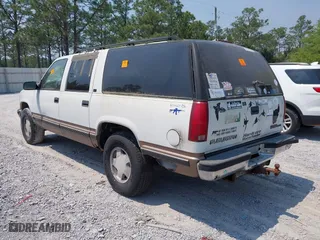 1996 GMC Suburban with VIN 1GKFK16R3TJ726521, listed as a IAAI auction lot 42055945 with 170,893 mi miles. Bid and sale history available at carsss.com. Image 3.