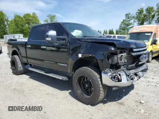 2021 Ford Super Duty F-250 SRW XL with VIN 1FT7W2BT1MEC51277, listed as a Copart auction lot 54199165 with 99,324 mi miles and Salvage Title. Bid and sale history available at carsss.com. Image 4.