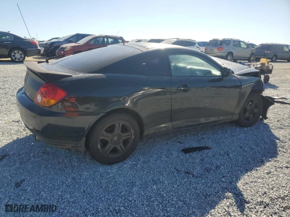 2003 Hyundai Tiburon GT with VIN KMHHN65F33U072954, listed as a Copart auction lot 77698094 with 235,445 mi miles and Salvage Title. Bid and sale history available at carsss.com. Image 3.