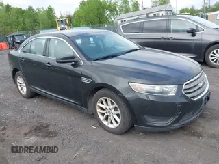 2014 Ford Taurus SE z VIN 1FAHP2D87EG165025, wystawiony jako IAAI lot #42226401 z przebiegiem 209 411 mil mil oraz . Historia ofert i sprzedaży dostępna na DreamBid. Obrazek 1.