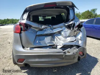 2014 Mazda CX-5 Touring with VIN JM3KE4CY9E0415402, listed as a Copart auction lot 56576114 with 181,719 mi miles and Salvage Title. Bid and sale history available at carsss.com. Image 6.