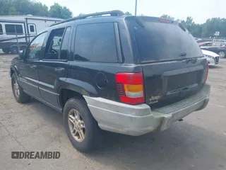 2003 Jeep Grand Cherokee Laredo with VIN 1J4GW48S03C557756, listed as a IAAI auction lot 42507884 with 195,236 mi miles and . Bid and sale history available at DreamBid. Image 3.